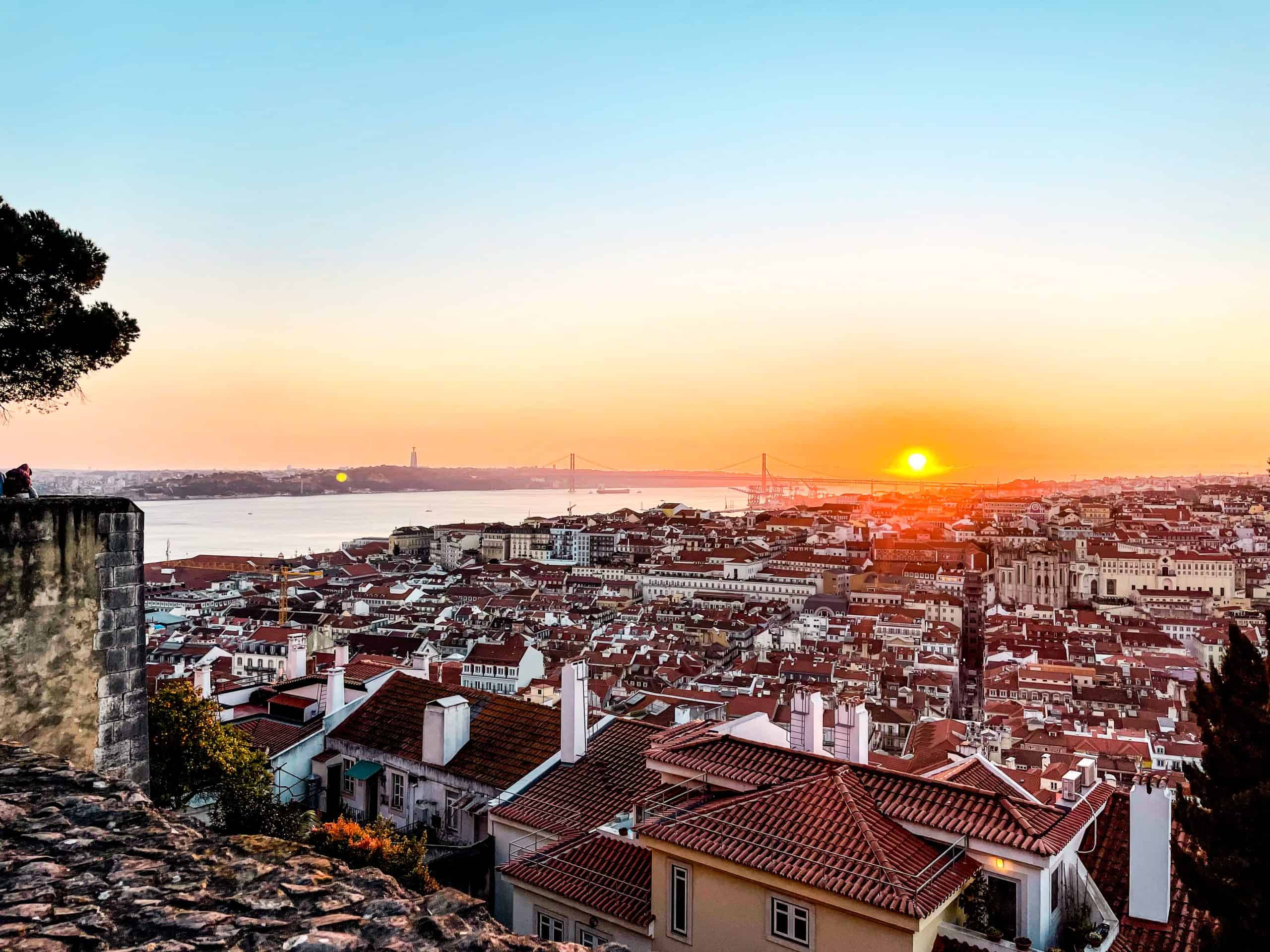 A vibrant sunset with the beautiful landscape of Lisbon, Portugal