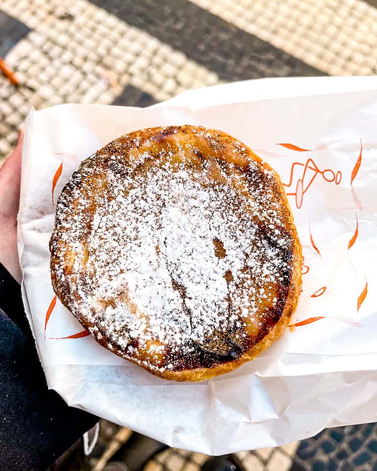 5 Days in Lisbon Pastel de Nata with powdered sugar from a bakery in Lisbon, Spain