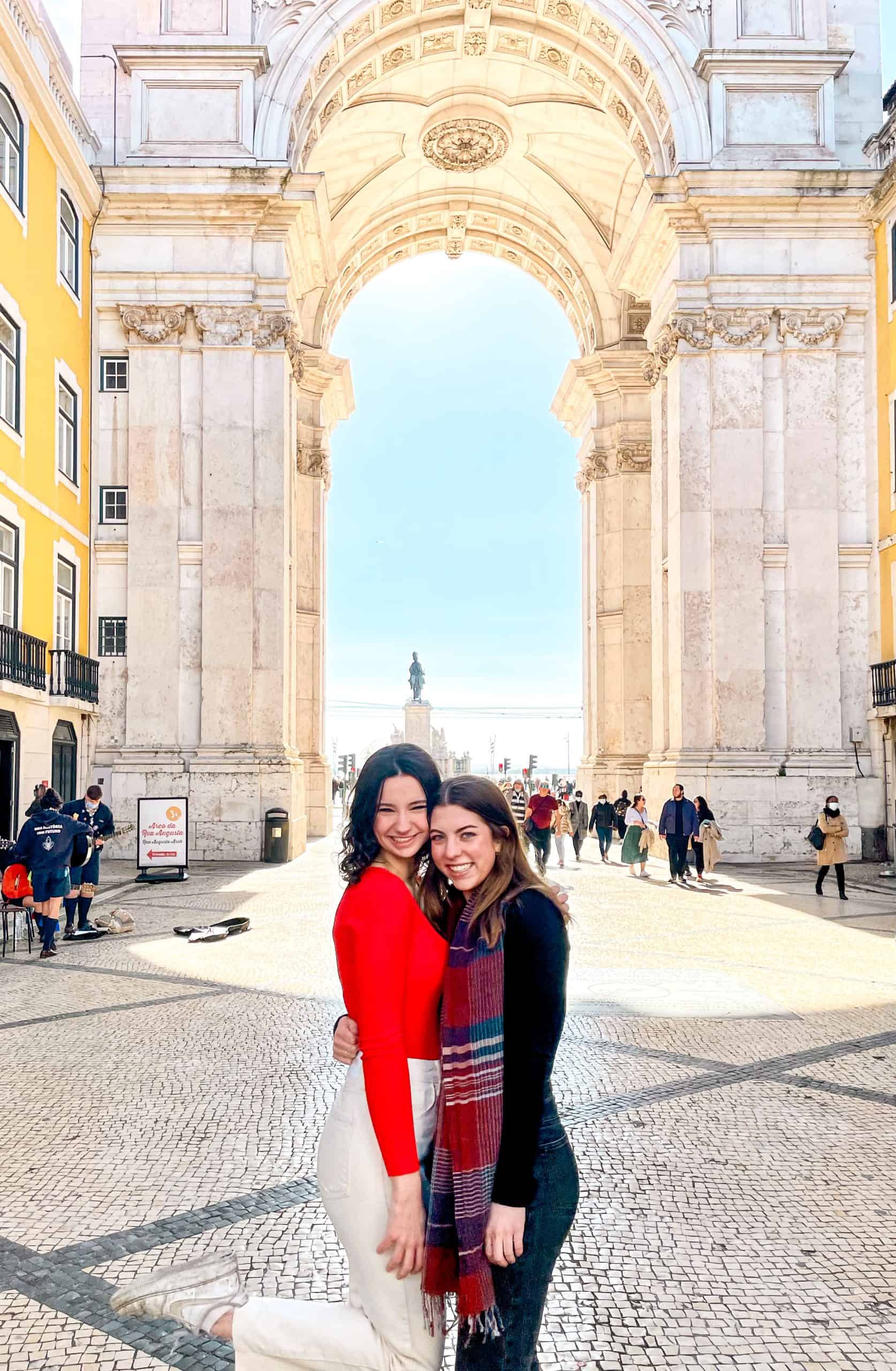 5 Days in Lisbon Two young women posing for the camera near Praça do Comércio in Lisbon, Portugal