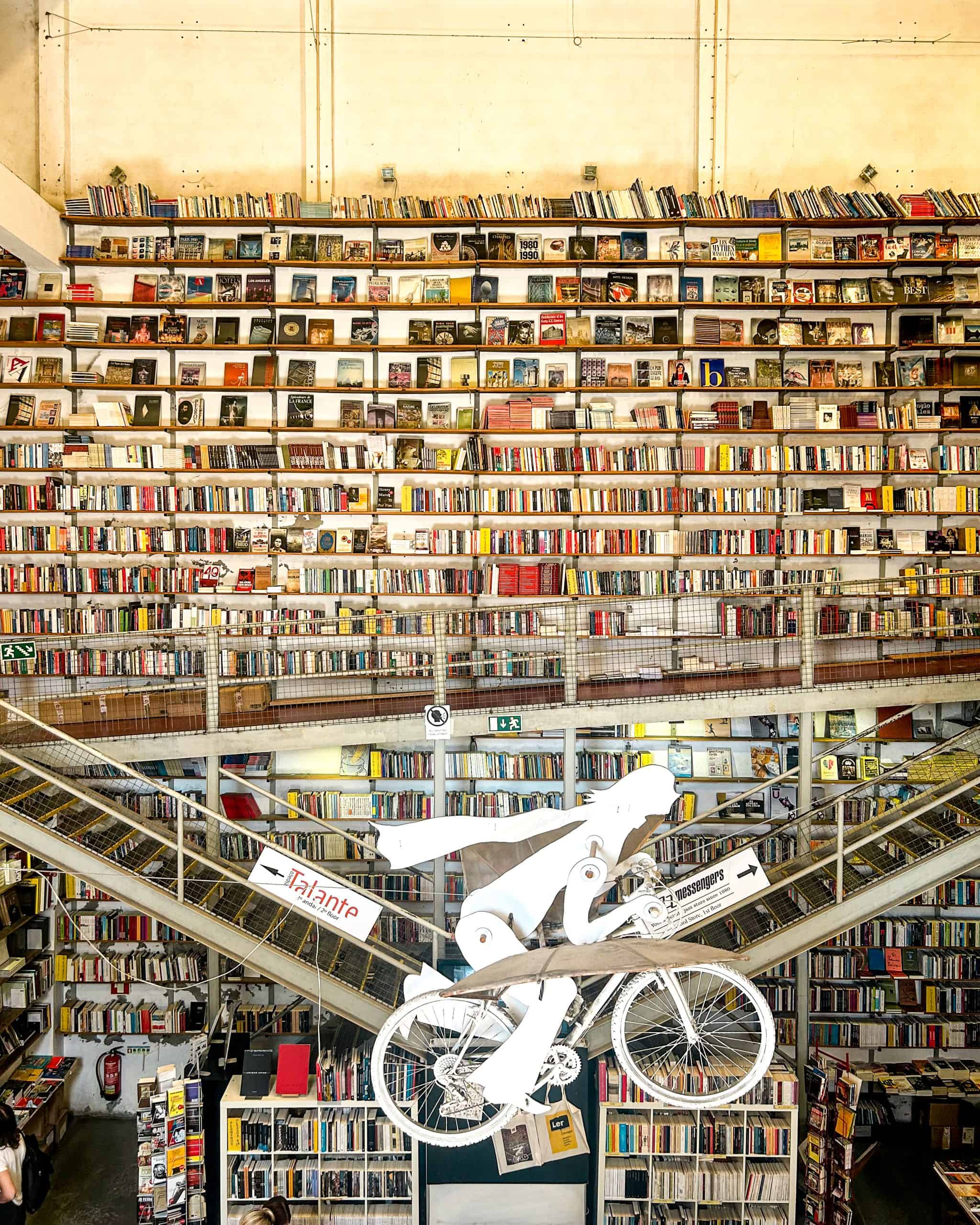 5 Days in Lisbon Tall wall full of books at the Ler Devagar bookstore in Lisbon, Portugal.