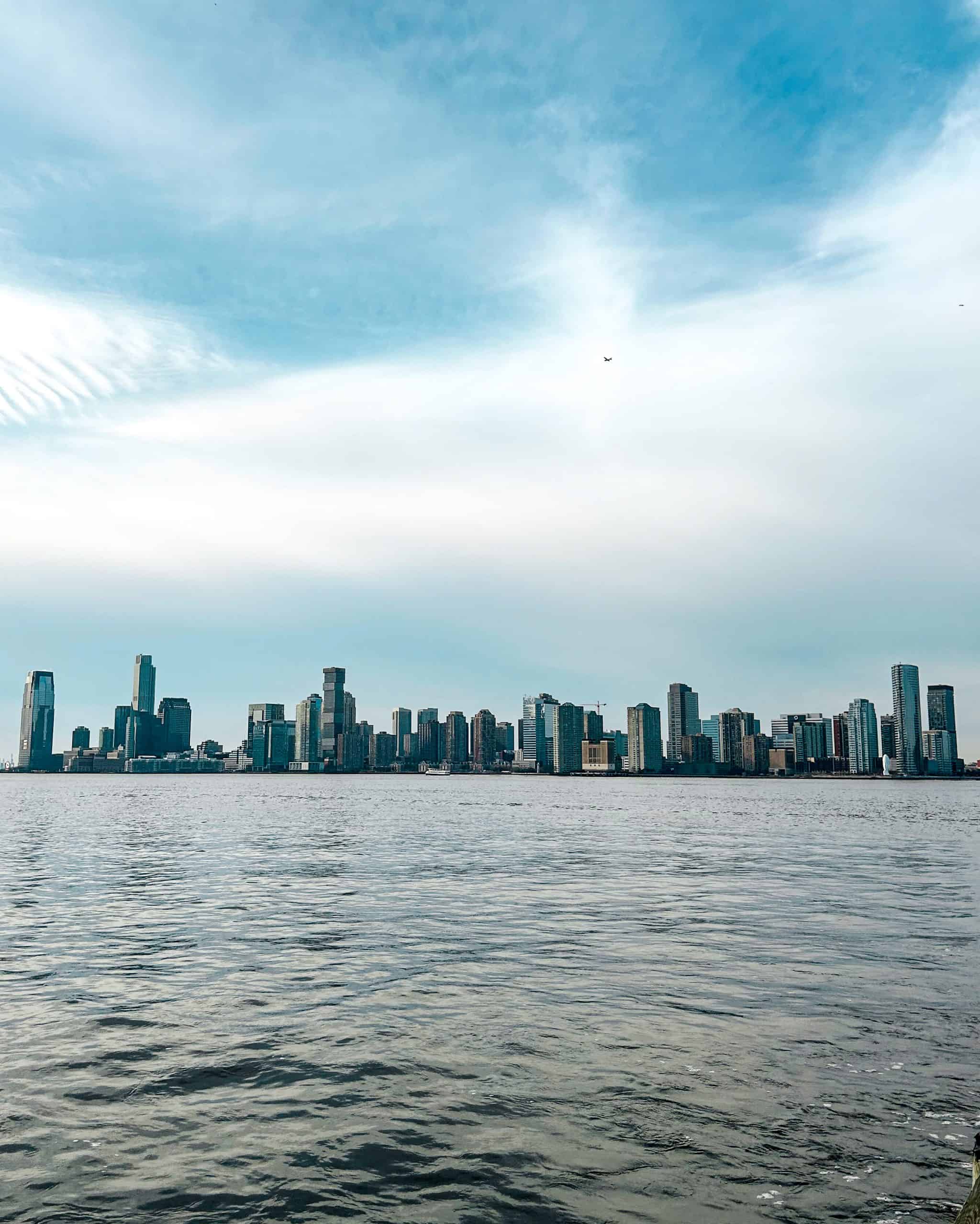 Views of a city skyline from the West Side Highway in New York