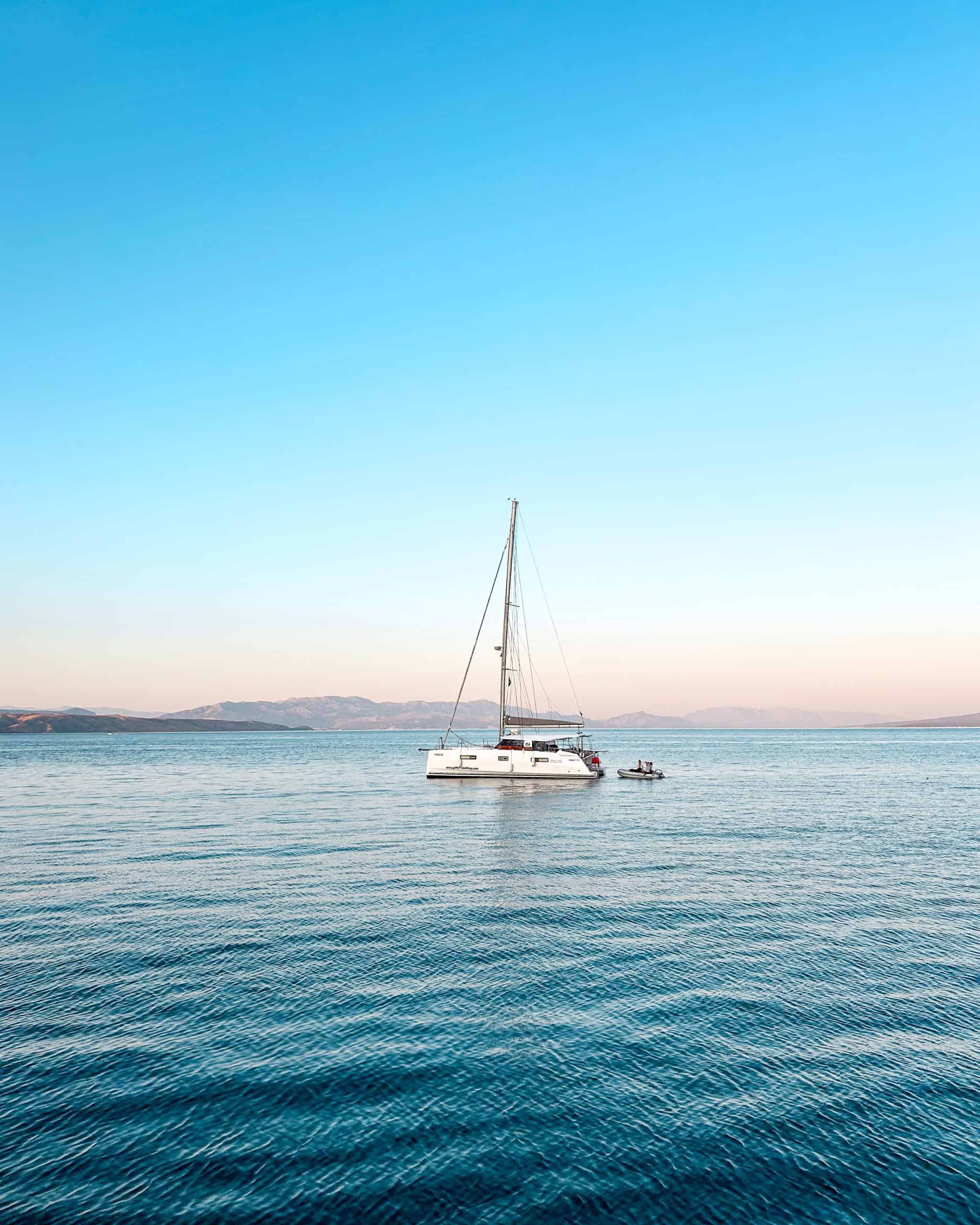 Is Croatia worth visiting? Sailboat in the middle of the Adriatic Sea in Croatia at dusk