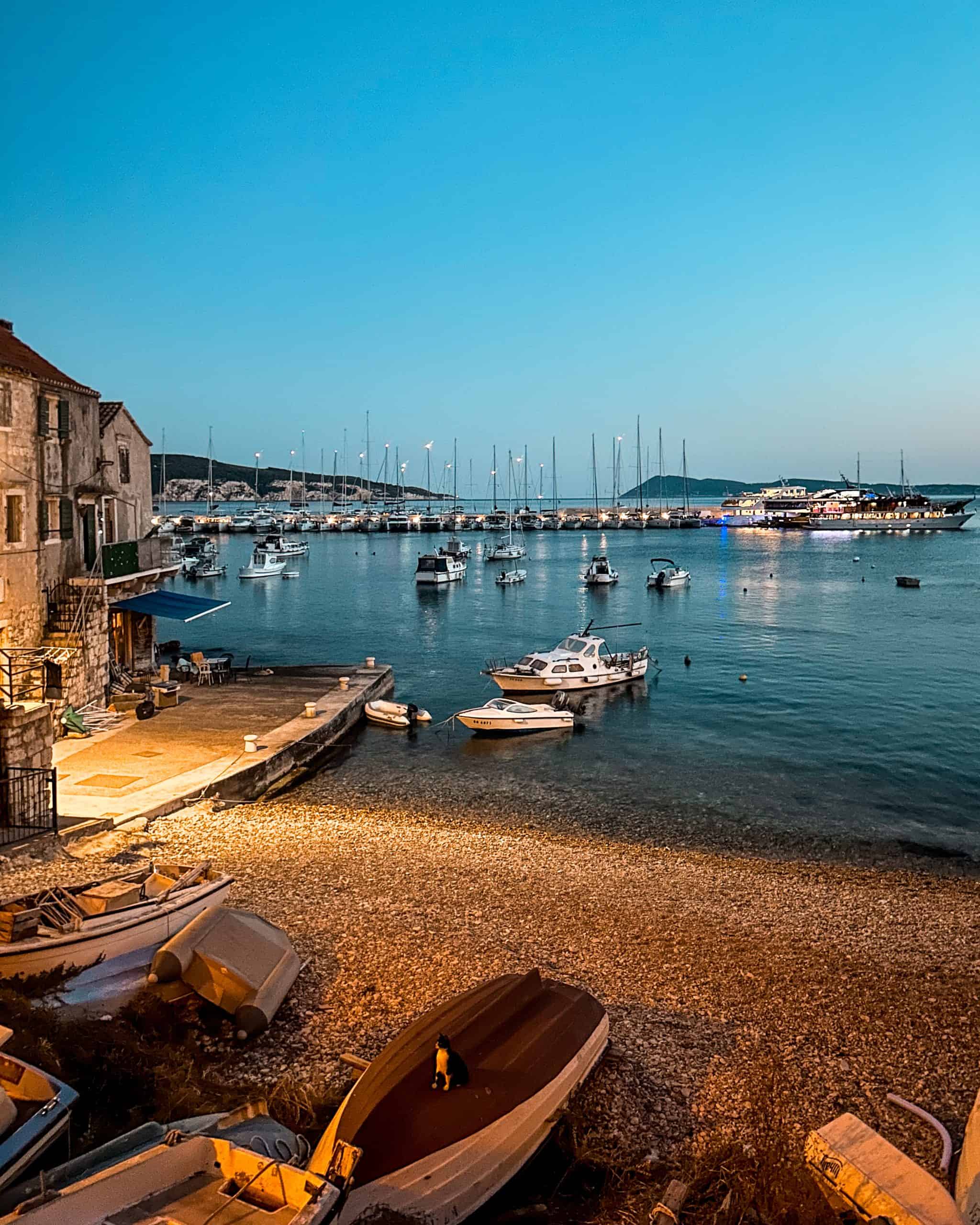 Is Croatia worth visiting? Many sailboats and catamarans in a marina at dusk in Croatia