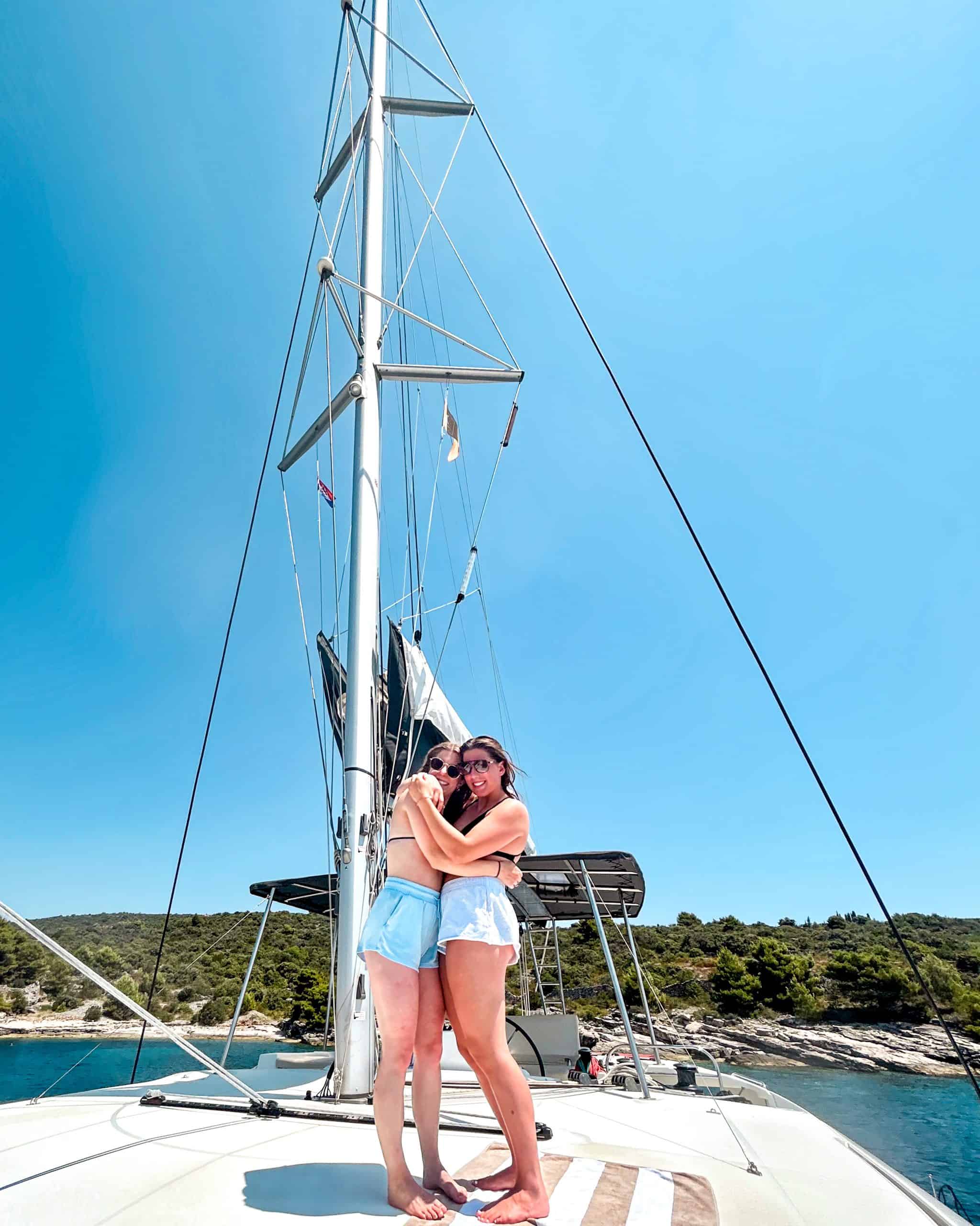 Is Croatia worth visiting? Two sisters hugging on a boat in Croatia