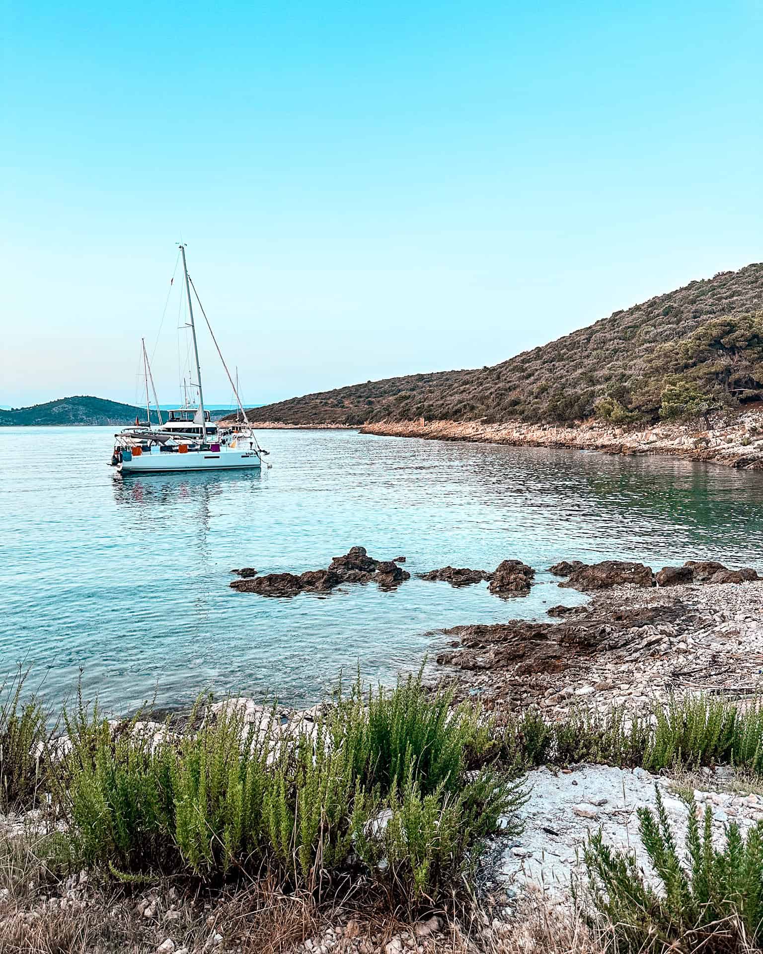 Is Croatia worth visiting? Catamaran in a remote cove off an island in Croatia