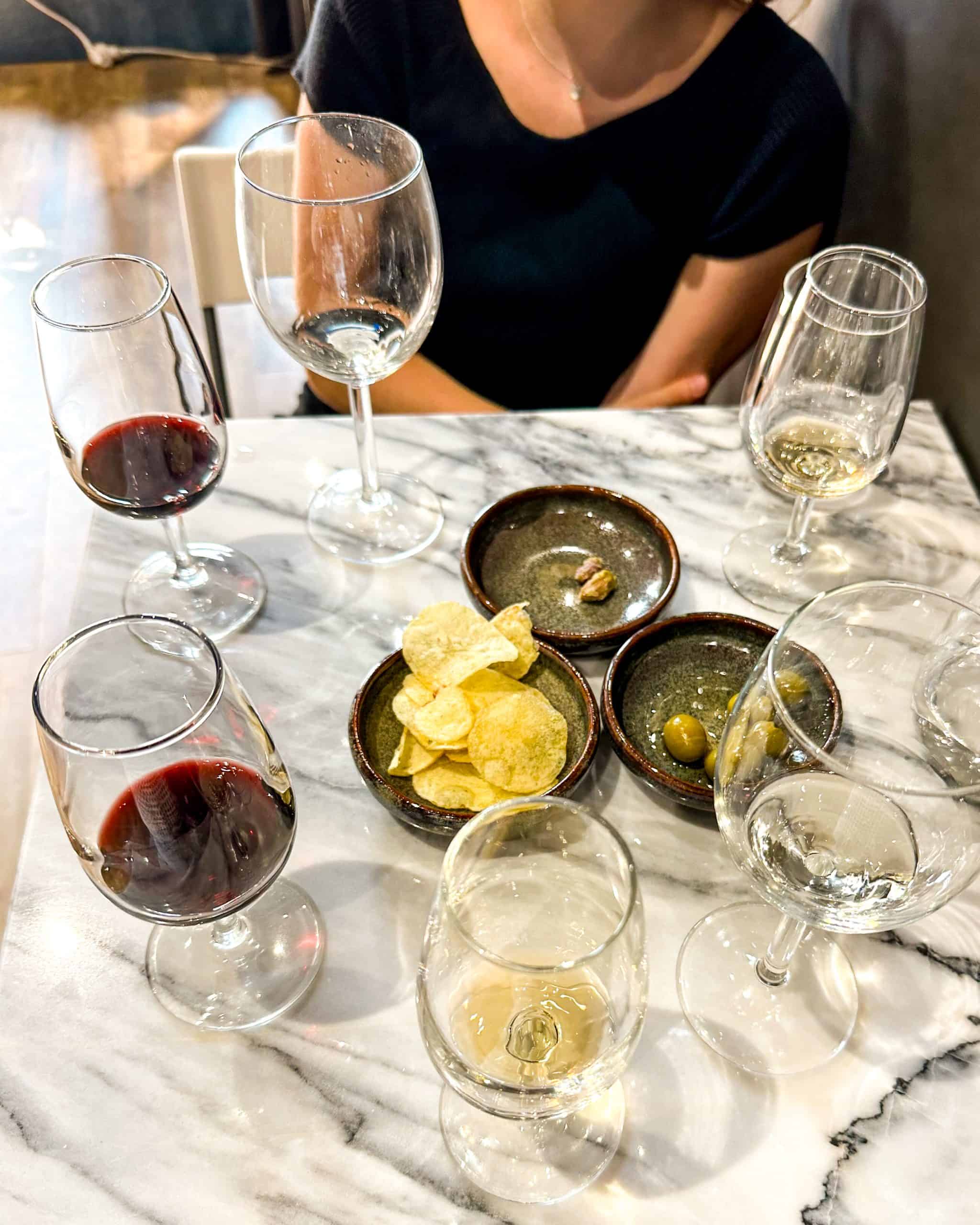 6 glasses of wine and some appetizers at a restaurant in Porto, Portugal 