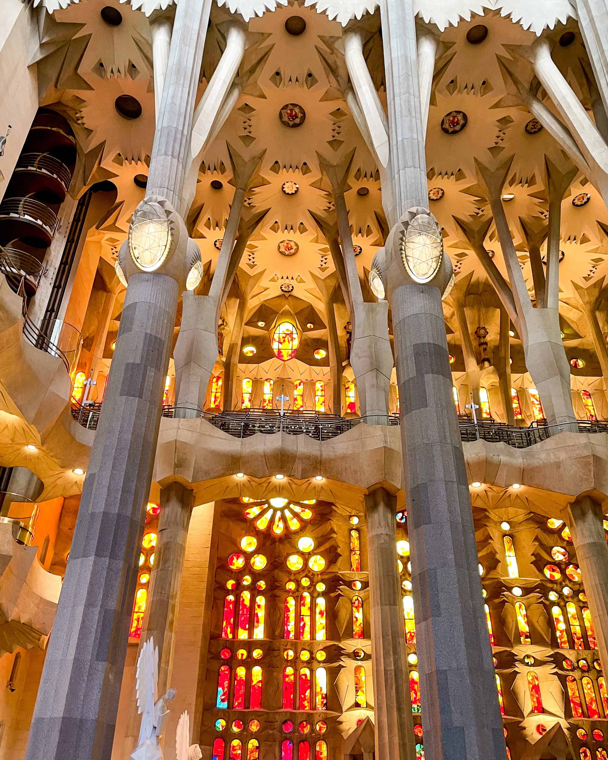 bright stain-glass windows and unique architecture in the Sagrada Família in Barcelona, Spain