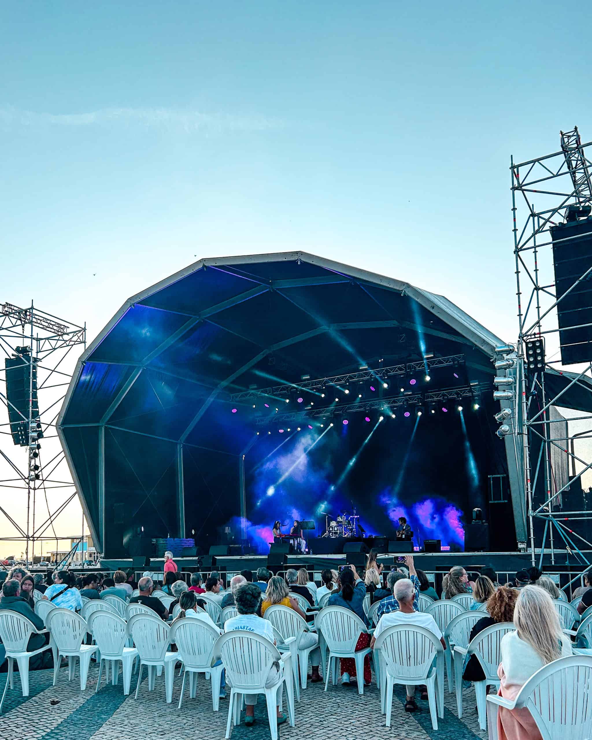 live music featuring a big stage and chairs in front on a summer night in Faro, Portugal