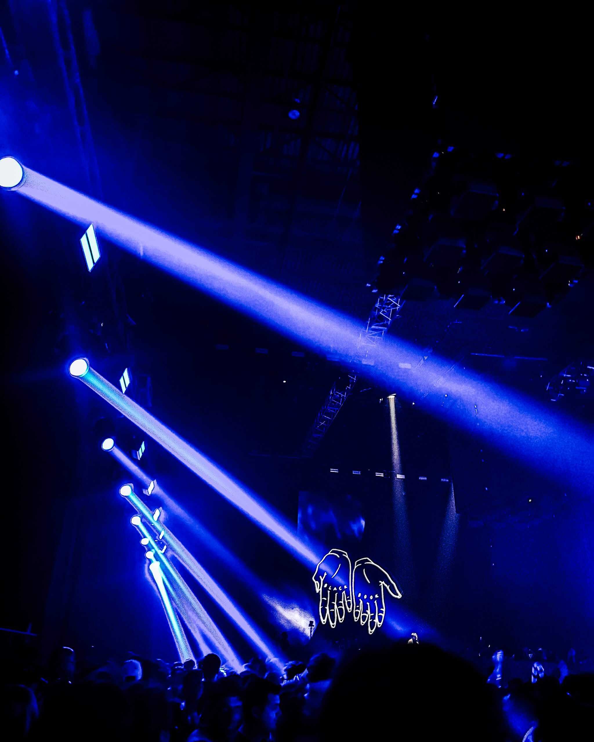 streaming lights and creative art on the stage at a concert at the Avant-Gardner in Brooklyn, New York