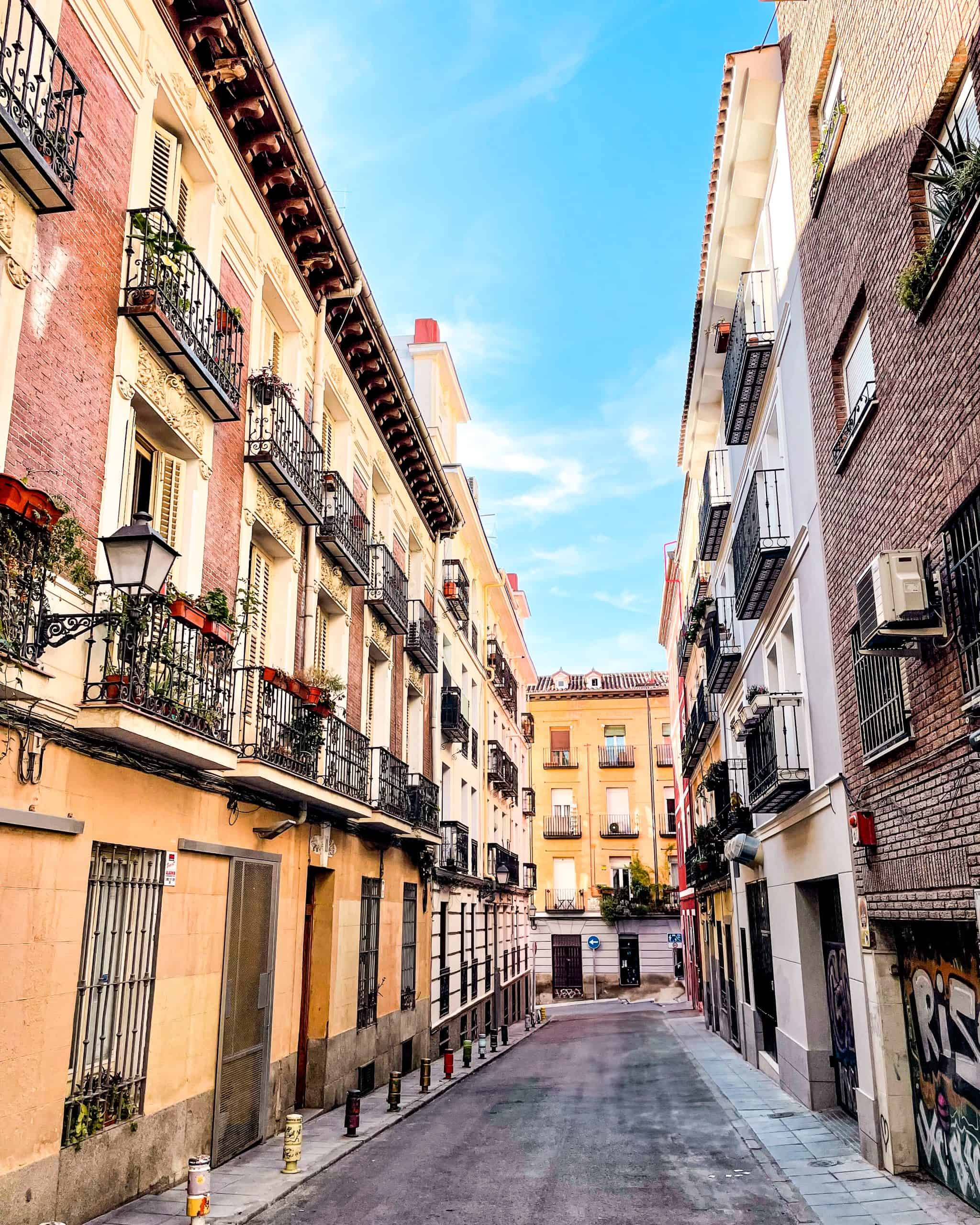 neighborhood street with cute balconies in Madrid, Spain