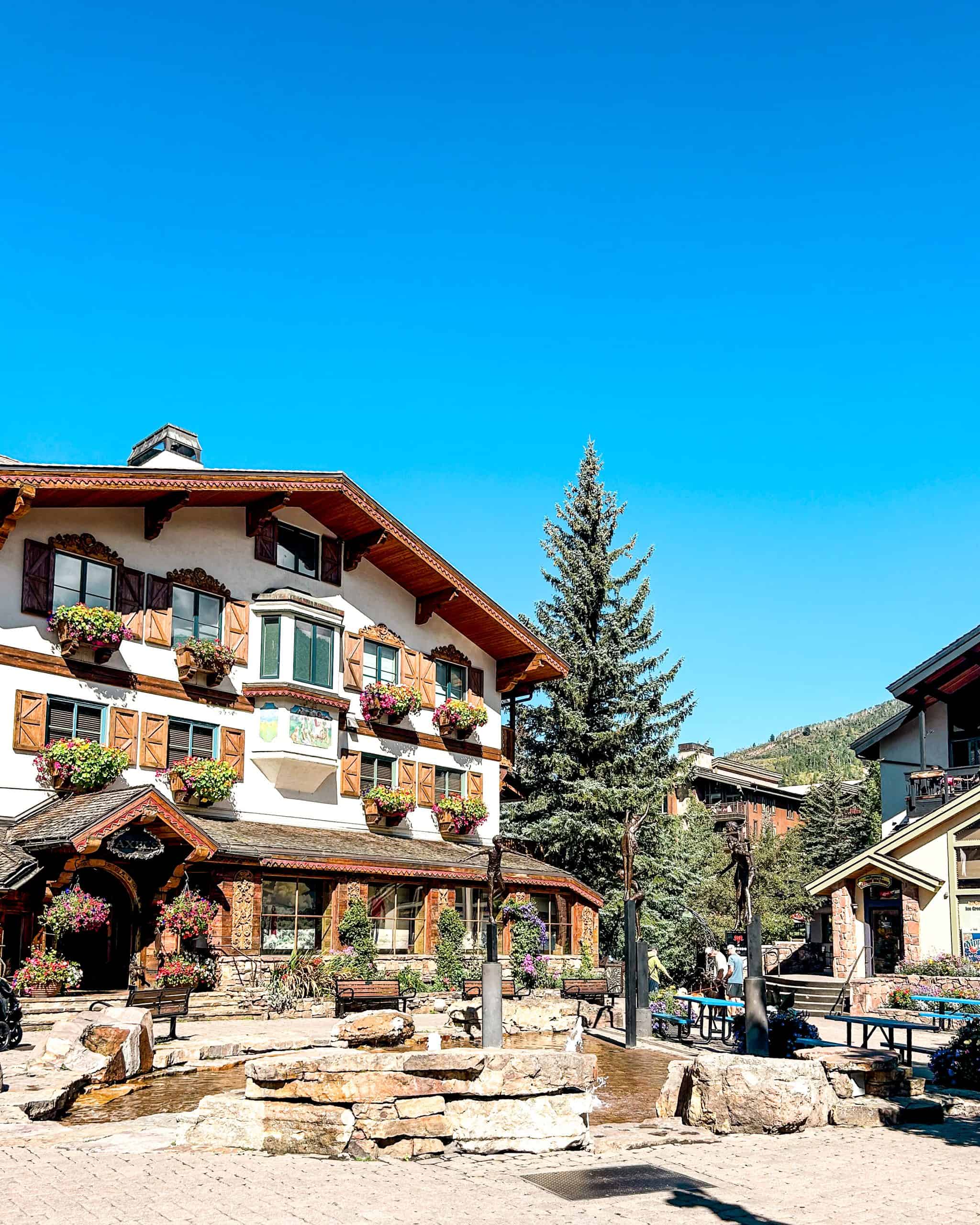 Vail Village in Colorado with alpine-style buildings, flower-lined walkways, and mountain resort charm in summer