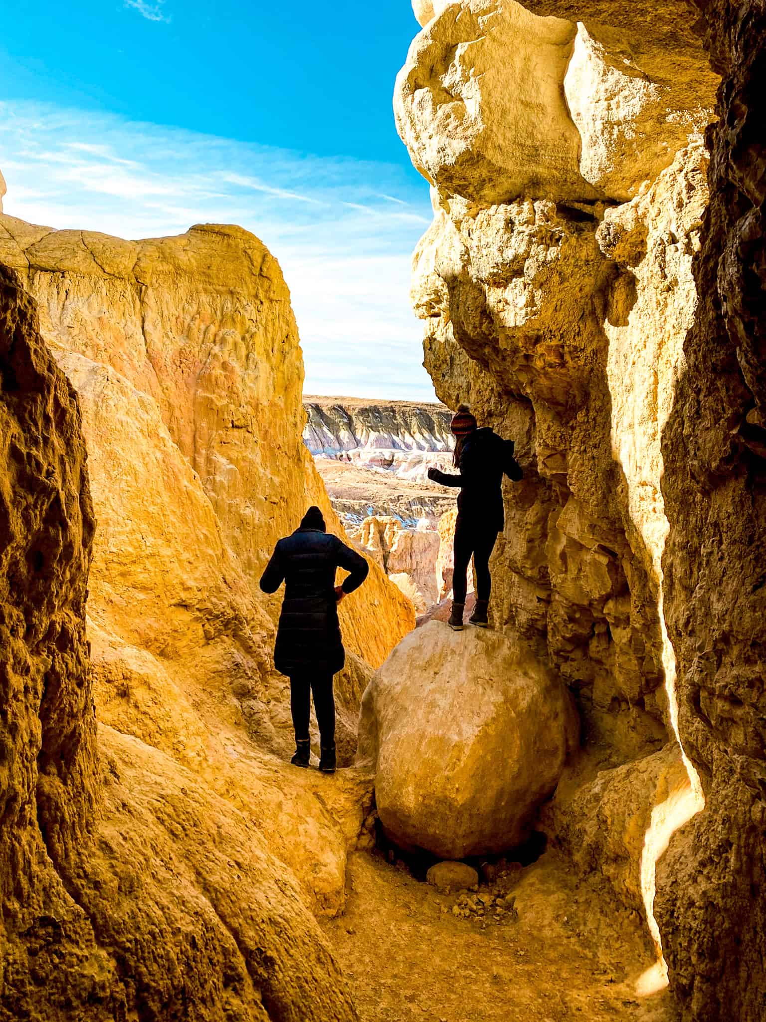 Visitors exploring the colorful clay formations at Paint Mines Interpretive Park, a unique day trip from Denver.