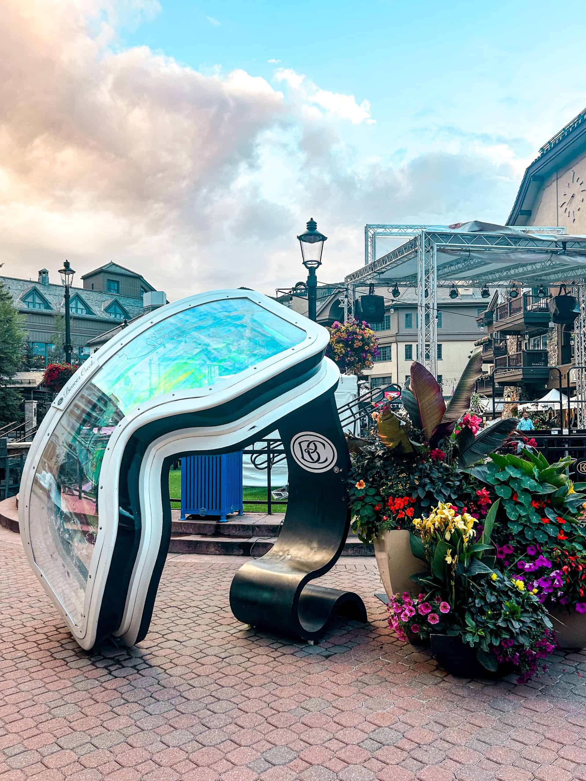 Beaver Creek Village in summer with outdoor art installation, flowers, and mountain architecture near Denver, Colorado