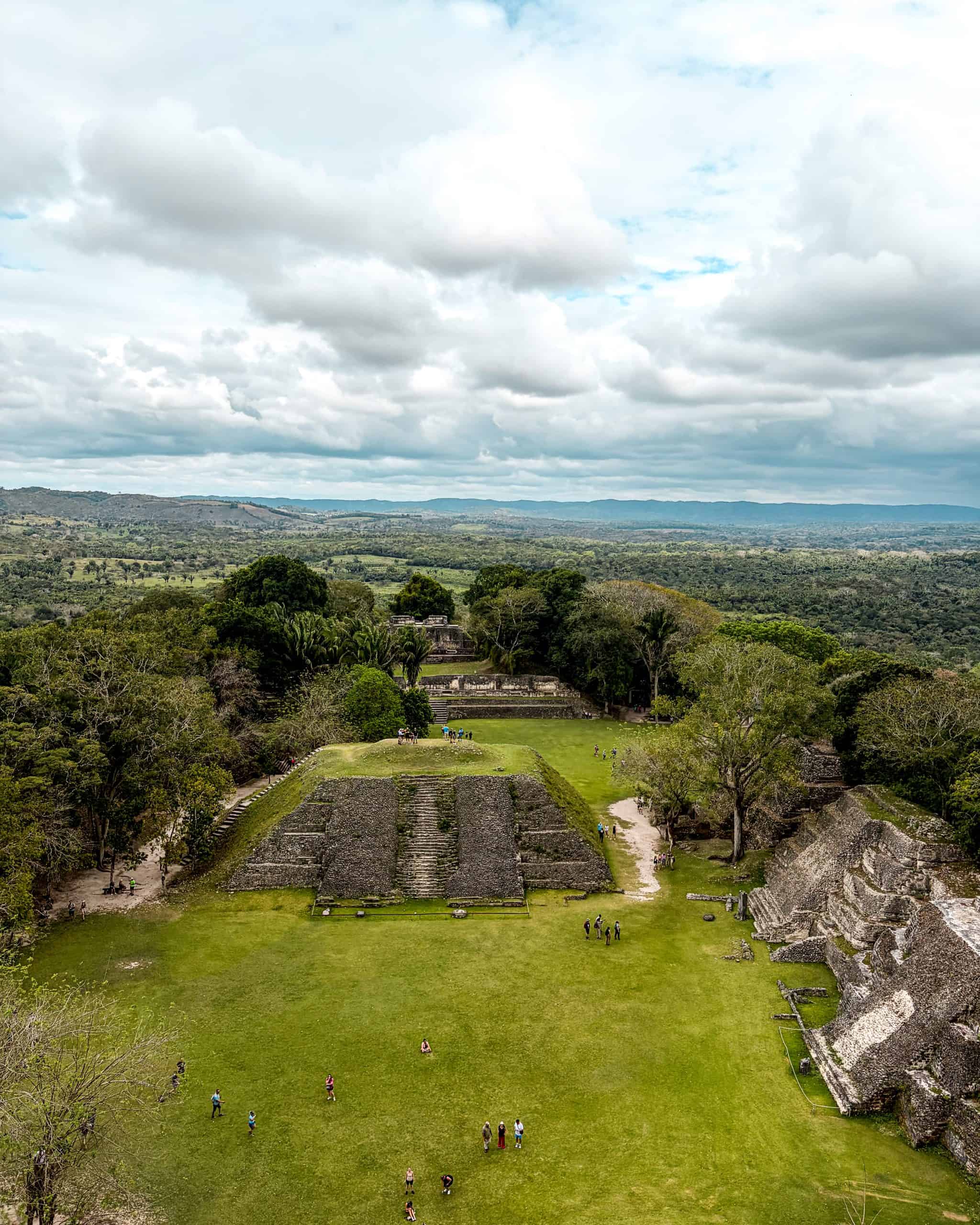 Ancient Mayan stone pyramid rising above the jungle canopy at Xunantunich, Belize
