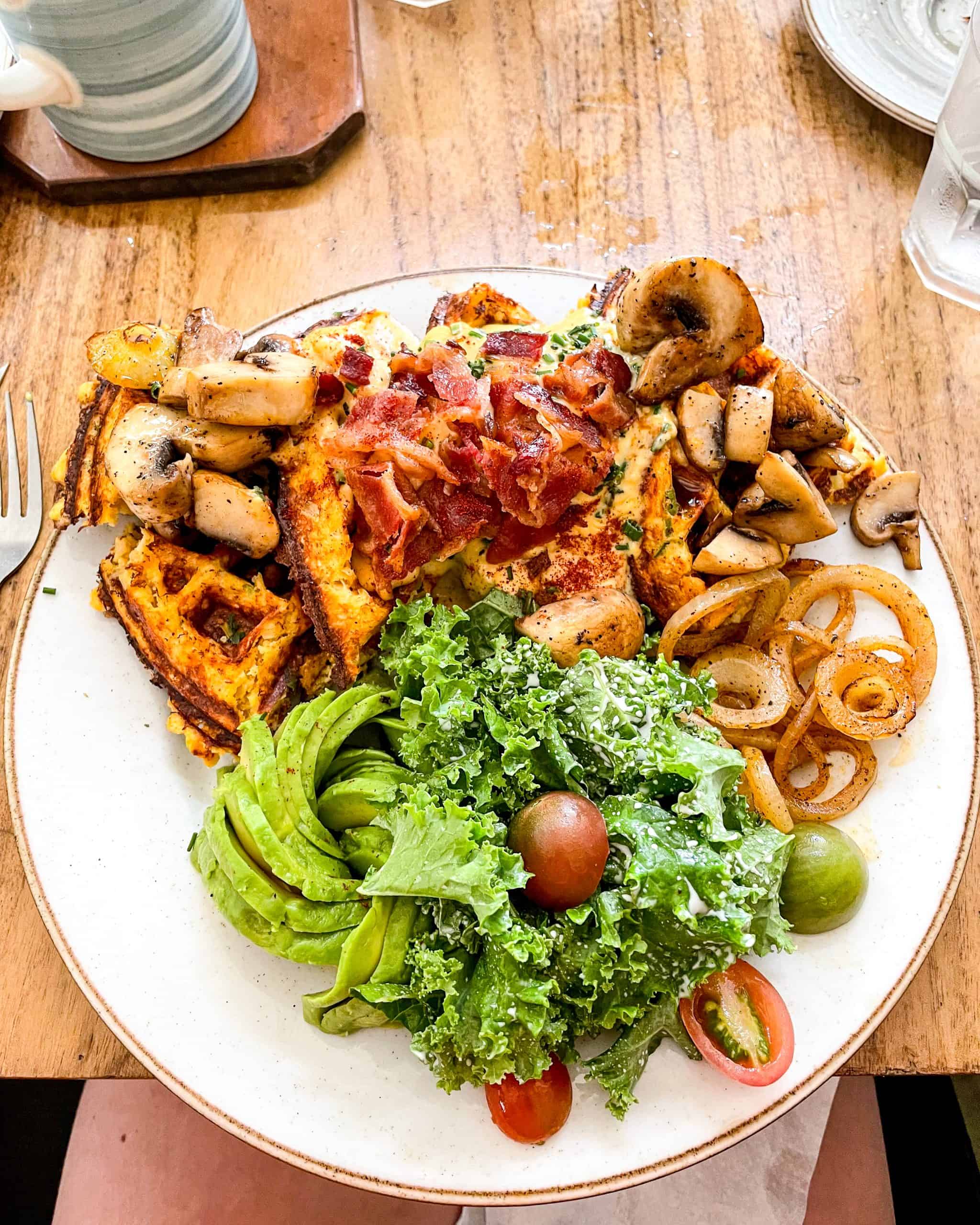 Brunch plate with eggs and sides at a Nosara, Costa Rica restaurant