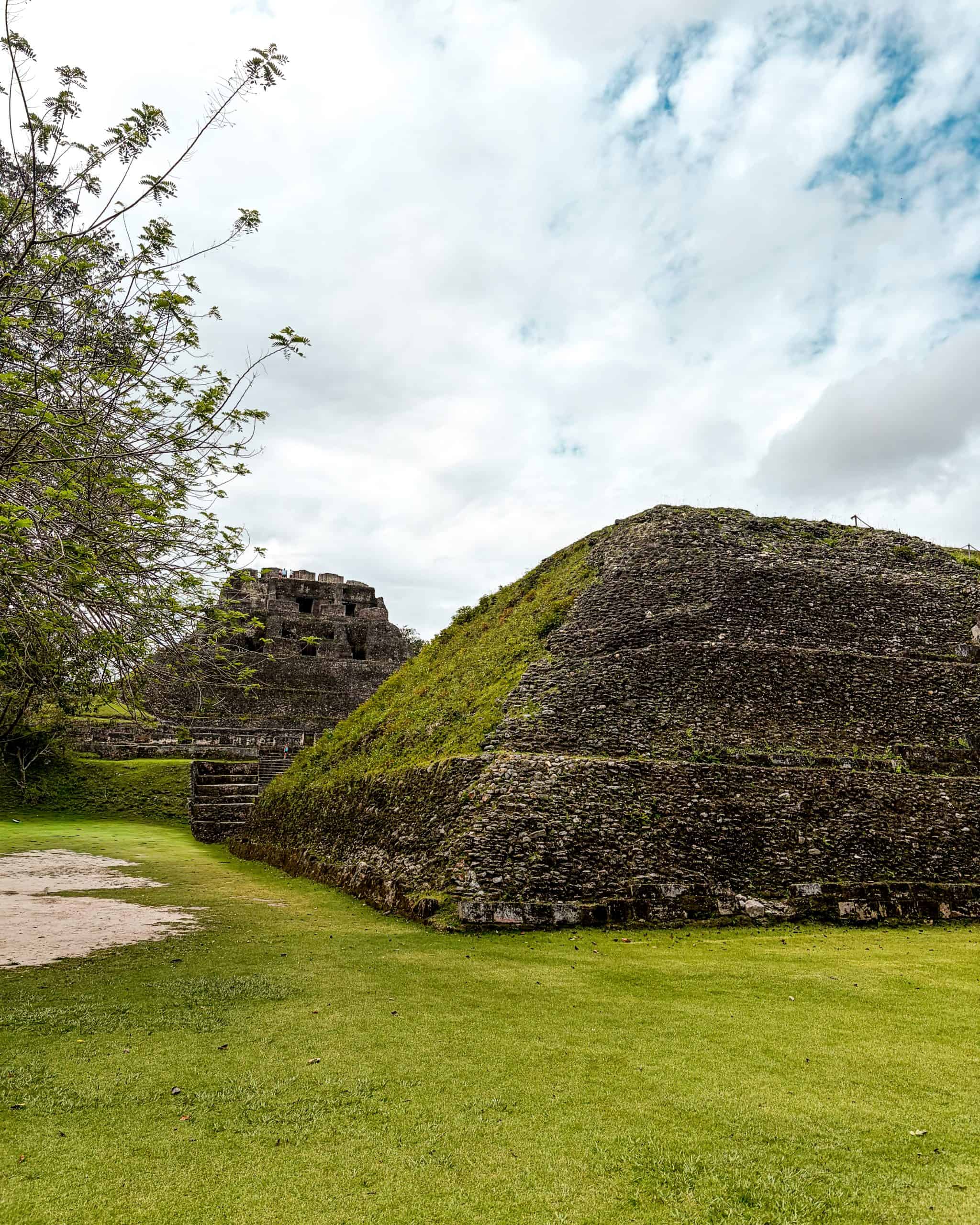 Stone Mayan temple at Xunantunich rising above the jungle on a clear day