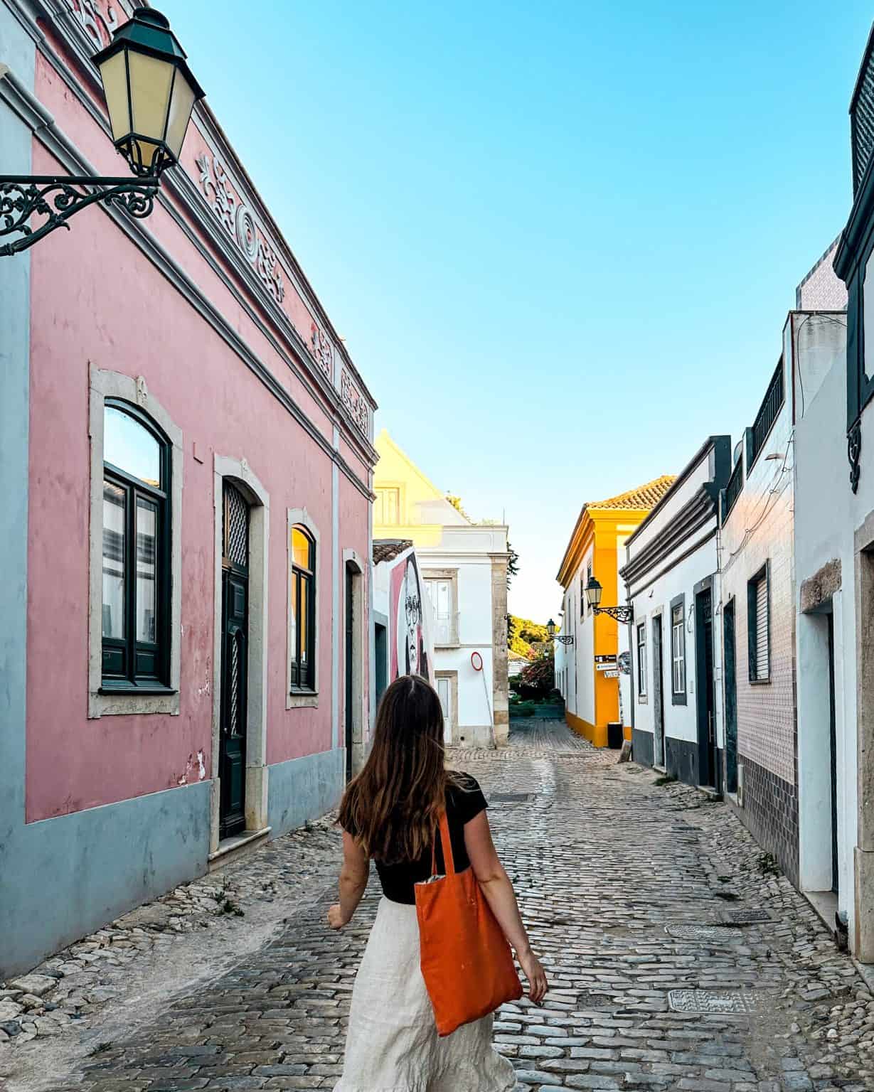 Walking through the old town in Faro, Portugal