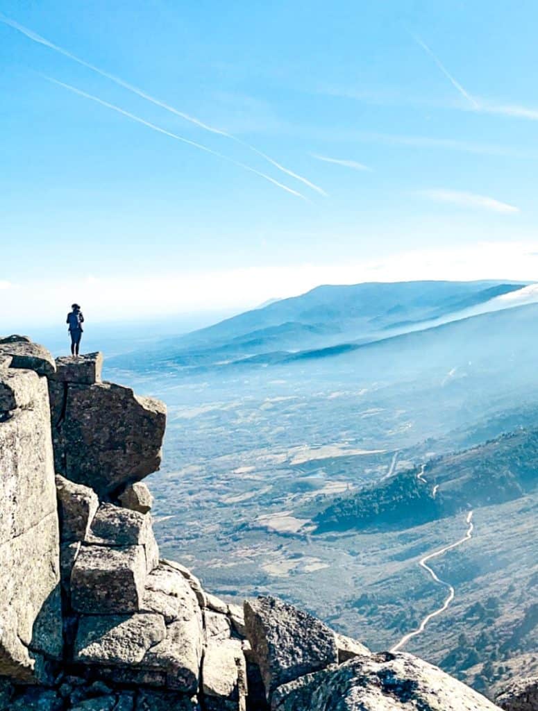 Standing on a granite ridge above a valley